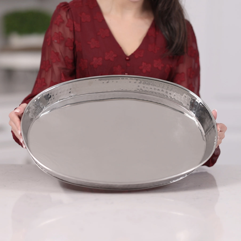 Serving tray made of stainless steel with a hammered exterior and easy to clean high glossy finish.  For wedding, birthday, or holiday party use in your home or on your patio.