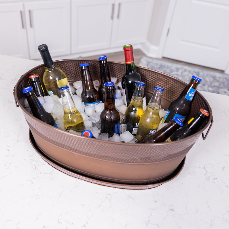 Copper beverage tub with tray in large oval shape.  Beverage tub tray catches spills, splashes and party tub condensation, protecting your tabletop or bar.