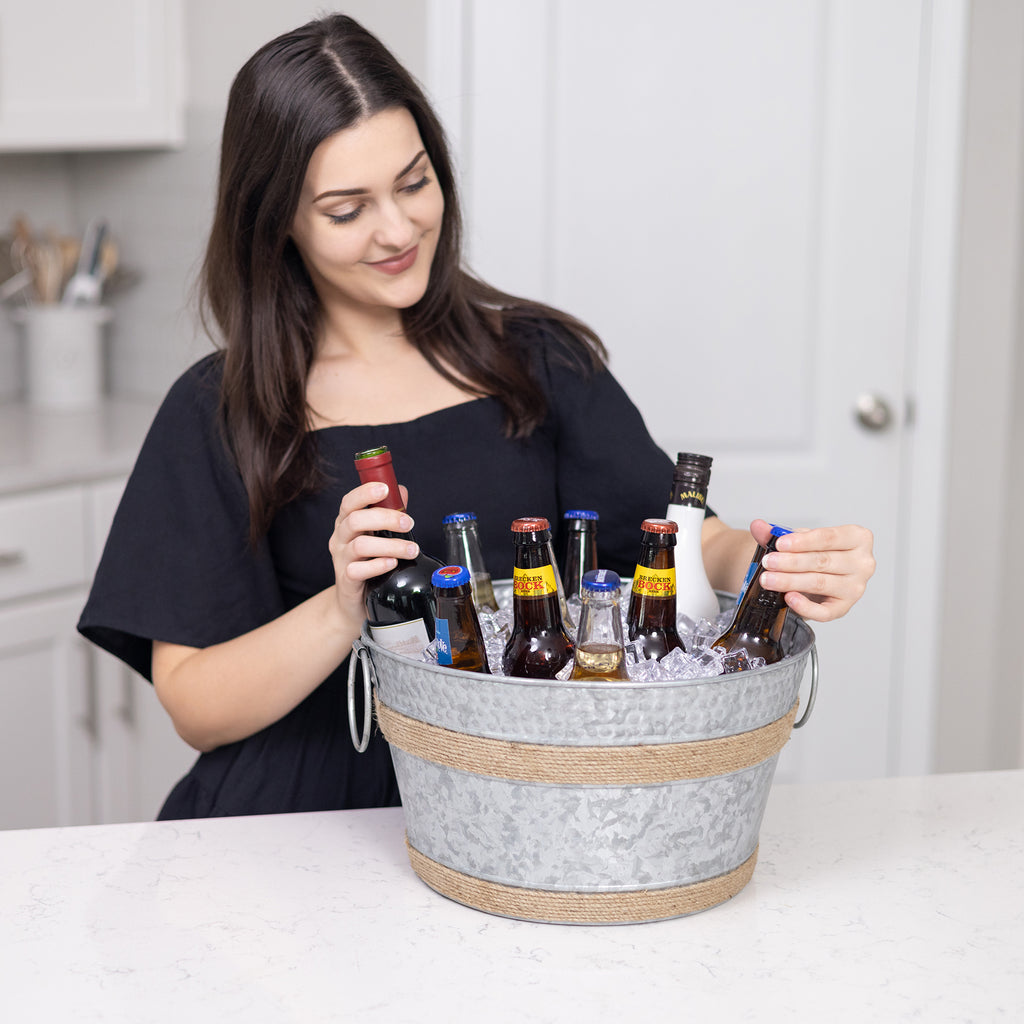 Ice bucket wine chiller made of premium galvanized steel for chilling beer, wine, and champagne at parties.  Celebrate a wedding, anniversary, or housewarming with this galvanized drink bucket.