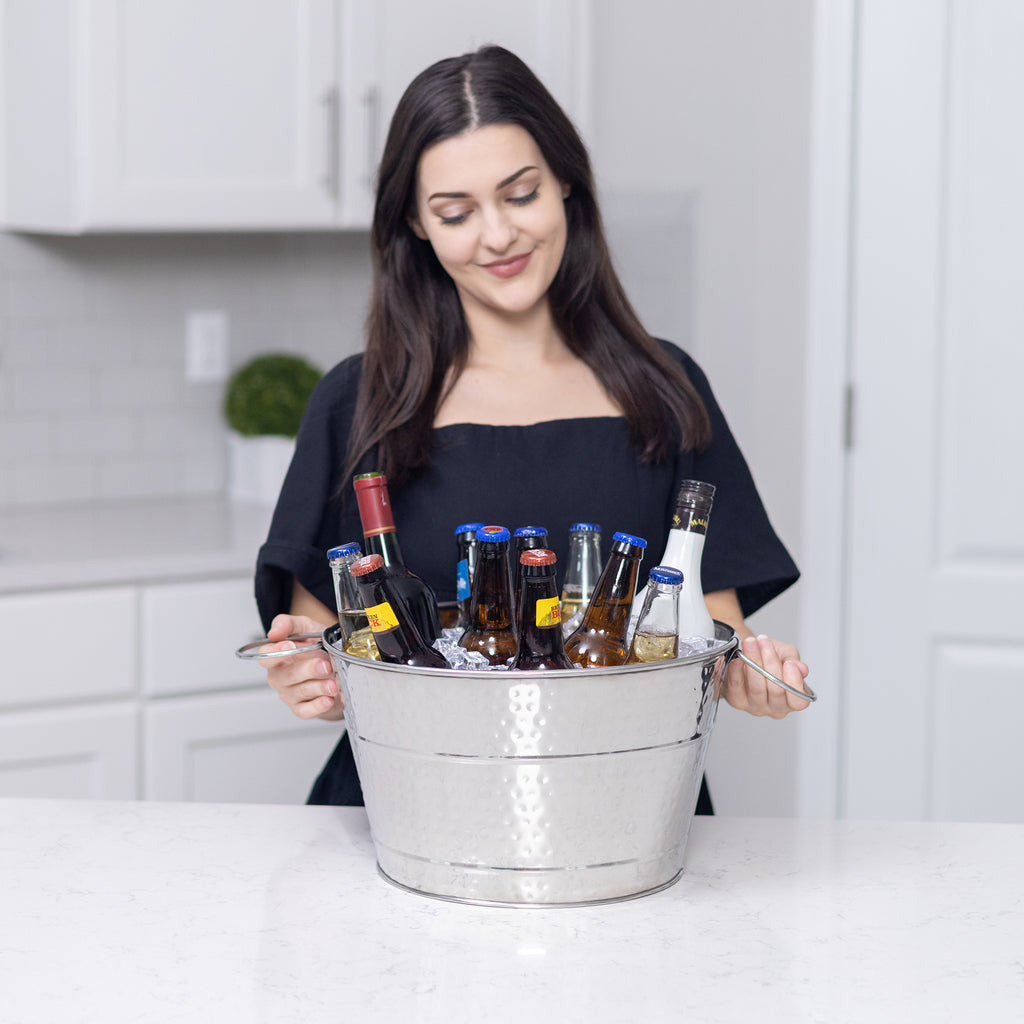 Metal gift basket that can be used to chill drinks made of stainless steel with handles and elegant hammered finish.  Round in shape with 4 gallon bucket capacity.