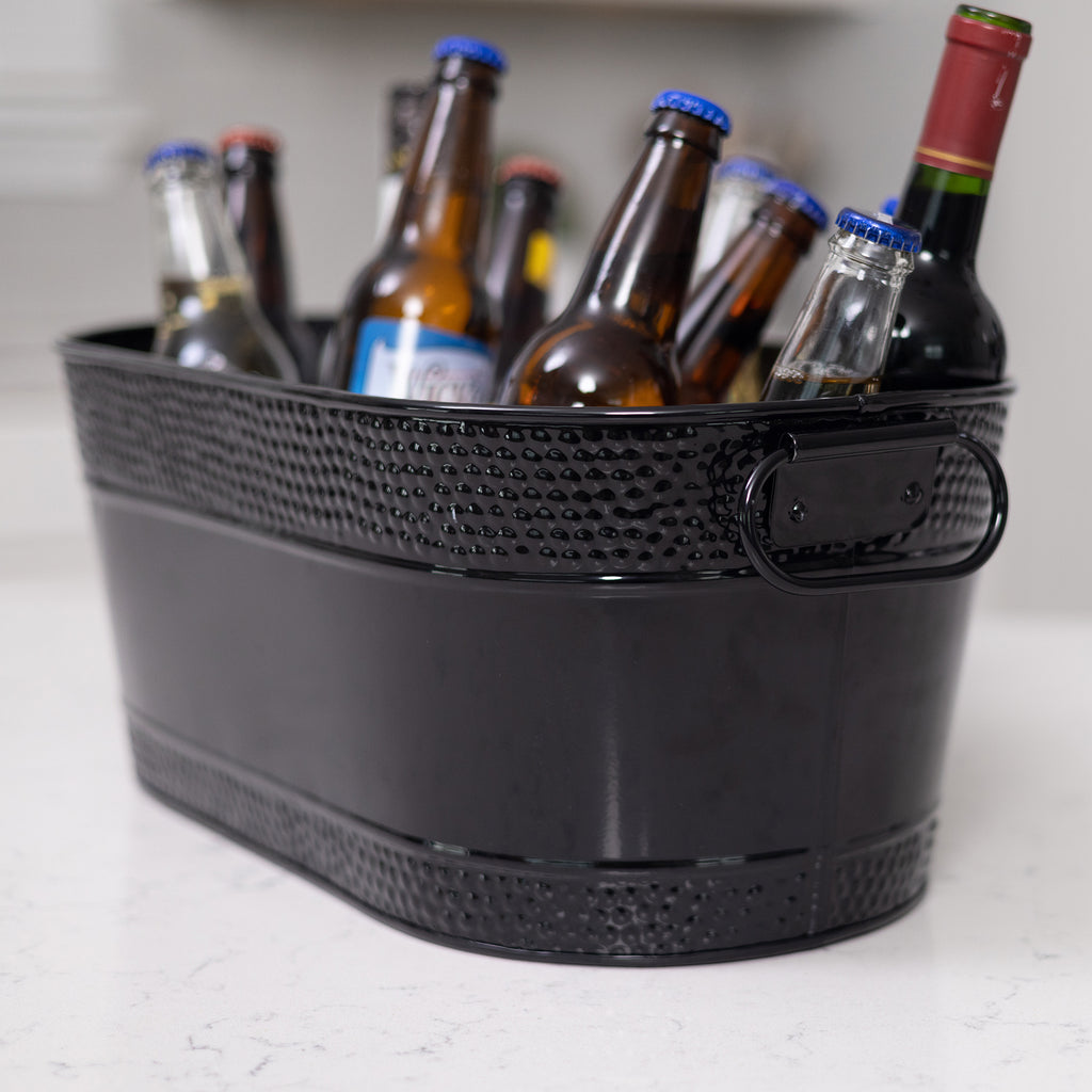 Metal drink bucket in black with hammered walls and strong handles.  High glossy and easy to clean with sealed bottom to prevent leaking and rust.  Great for inside and outside parties in the kitchen or on the patio.