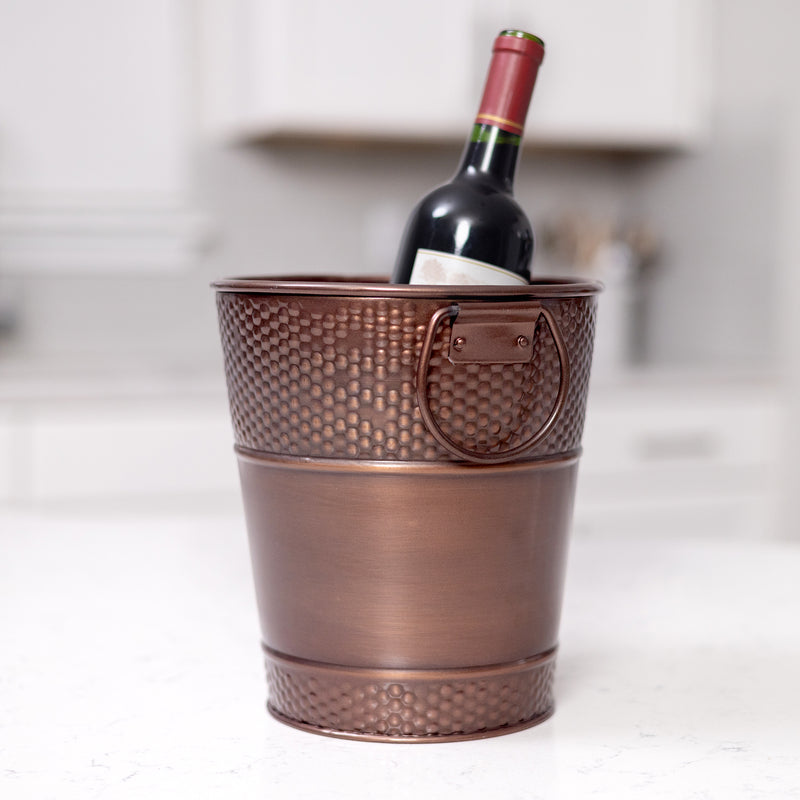 Copper wine buckets with handles for easy transport.  Made of durable metal for long lasting use.
