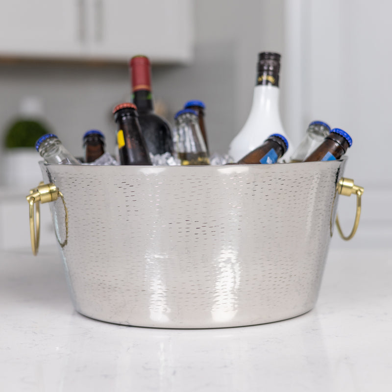 stainless steel silver party tub with gold handles.  round, insulated, double wall construction is 100% leak proof.  Great for the kitchen or bar to chill drinks with ice at parties at home or at event spaces.