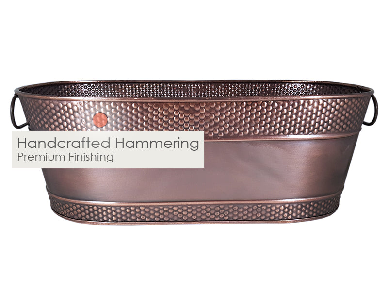 Drink bucket for chilling wine, champagne or beer.  Copper finish with handcrafted hammering on the outside for long lasting durability.