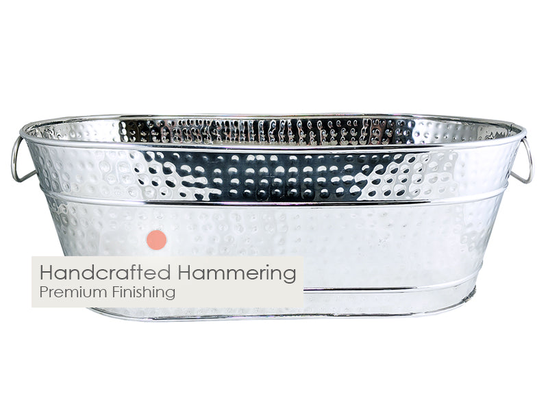 Metal bucket for drinks in oval shape with hammered finish.  Stainless steel material finished with an easy to clean high glossy finish.  