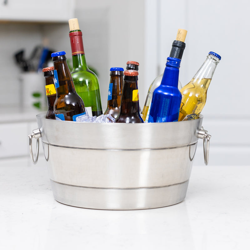 Large ice bucket for drinks at a party.  Exterior is dual finish of brushed stainless steel and mirrored stainless steel.