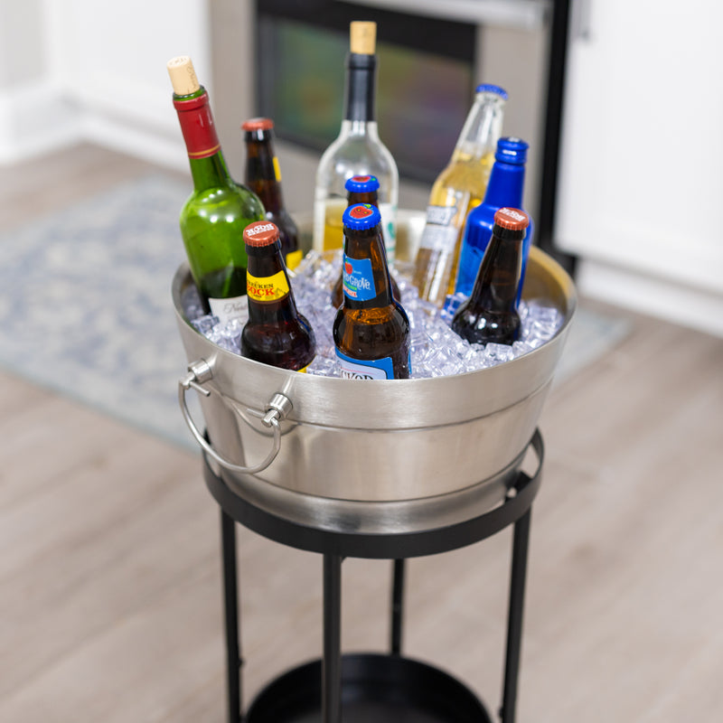 Metal drink bucket with stand for ice and chilling drinks at parties.