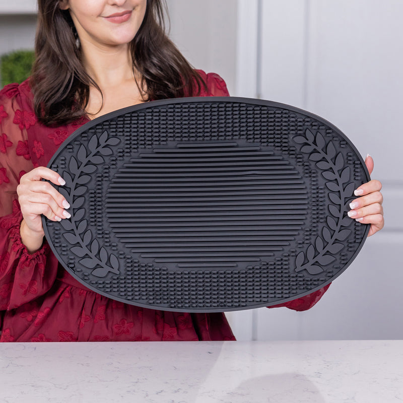 Large rubber party mat that protects your tabletop surfaces from splashes and spills.  Use under wine buckets on the cocktail bar or use as a dish drying mat in the kitchen.  Deep wells to catch the water, spills, and splashes.