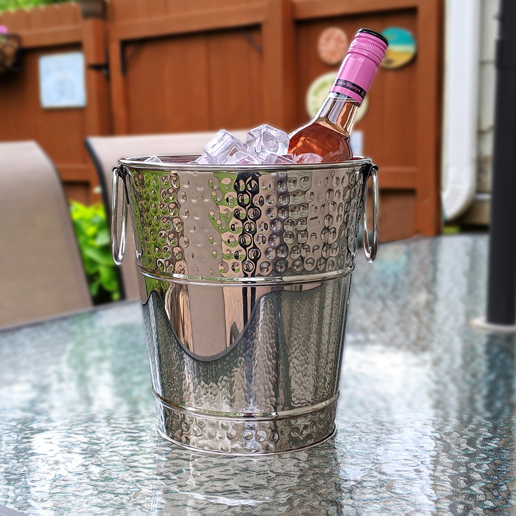 Wine or champagne bucket made of stainless steel metal to use in your kitchen, dining room, bar, or patio.  Hammered exterior and easy to clean mirrored glossy finish.